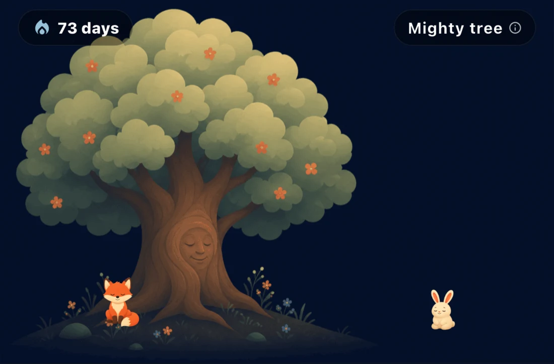 The Bounded garden at day 73: a mighty flowering tree with a sleeping fox beneath it and a rabbit at the edge